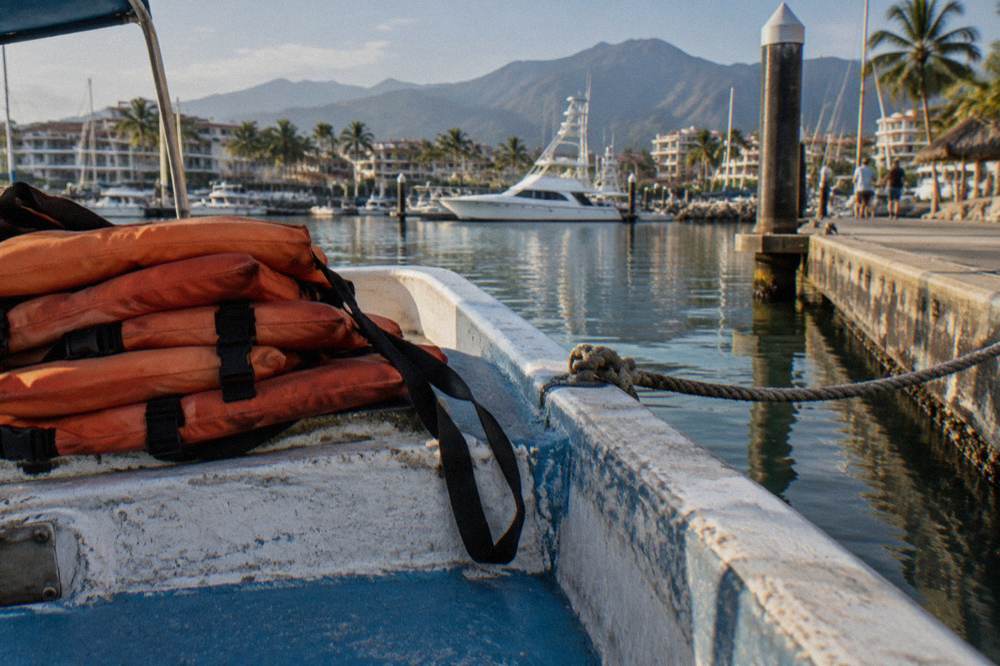 Life vests stacked on the deck of a whale watching boat ready for passengers