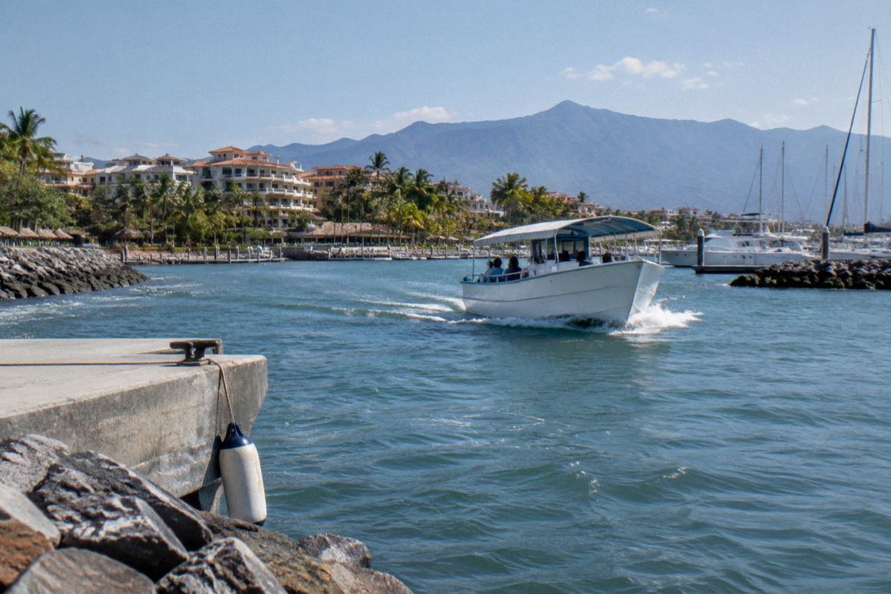 A small boat crossing open water in Banderas Bay near Puerto Vallarta