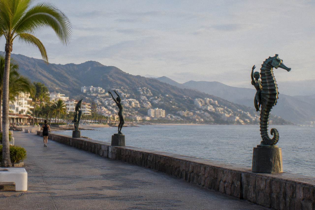 calm winter morning over Banderas Bay with the Puerto Vallarta coastline and hills in soft light