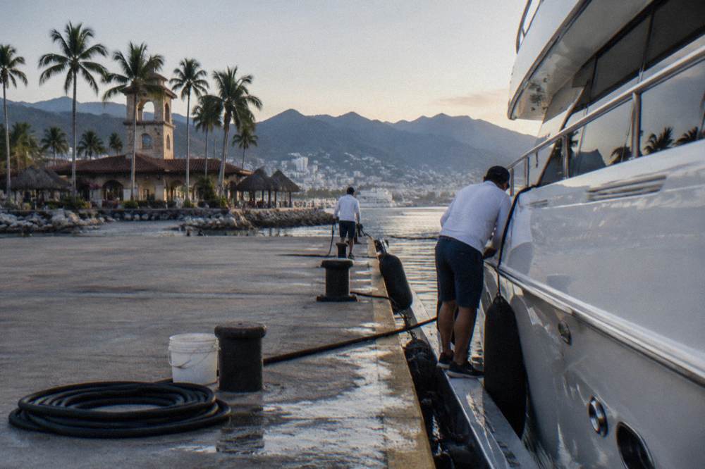 A private charter boat moored at a marina dock in Banderas Bay before a morning departure