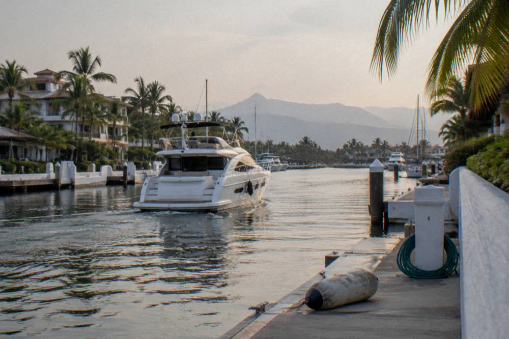A private boat cruising on calm water near the marina in Banderas Bay